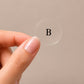 Close-up of a single clear Berberine Boost topical patch